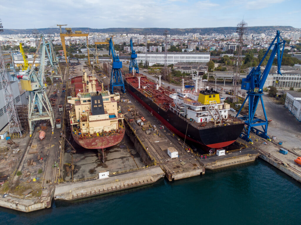 aerial view shipyard dry dock maintenance and repair cargo ship transport and oil ships in sea