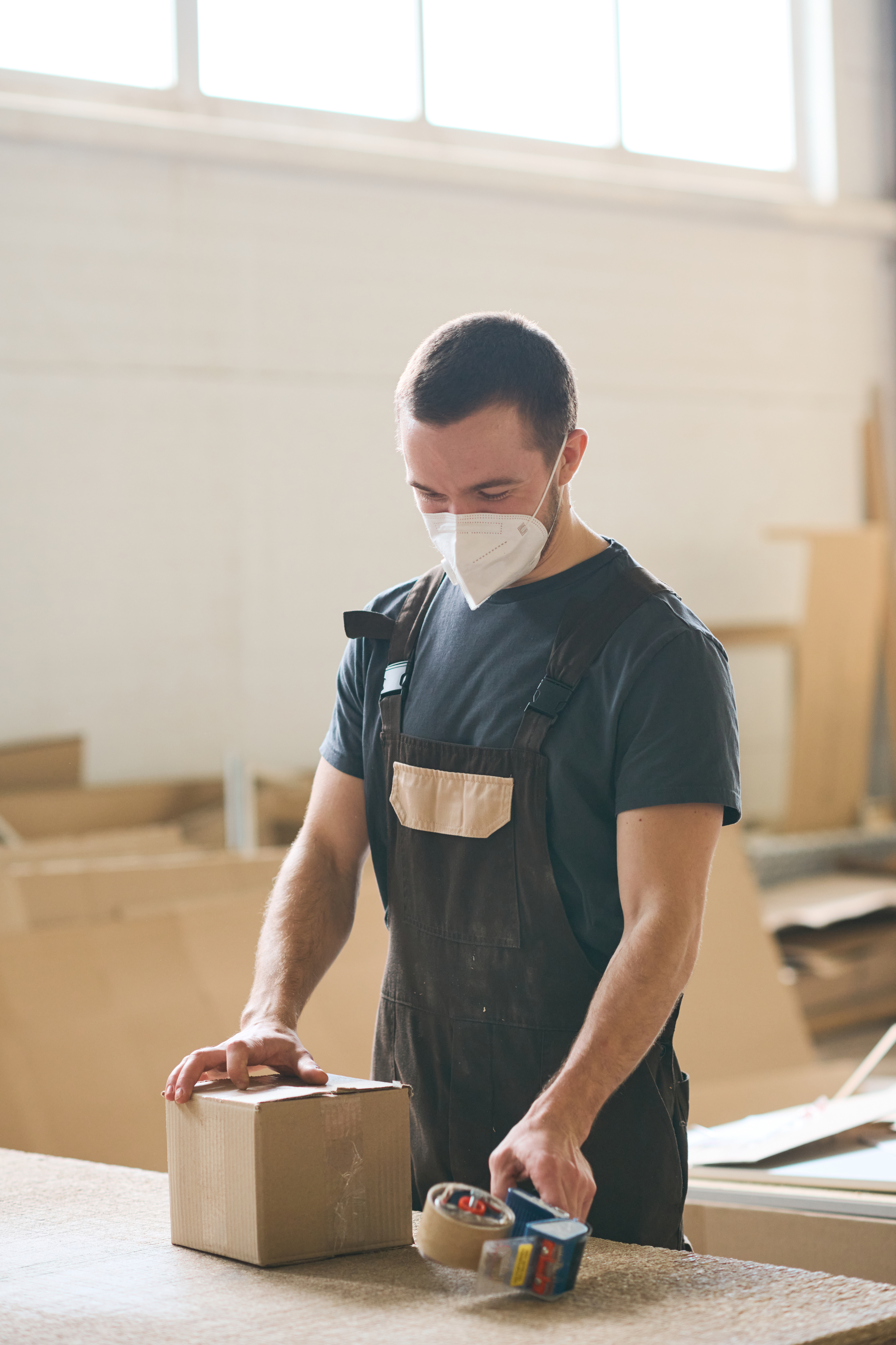 Man packing boxe before shipping