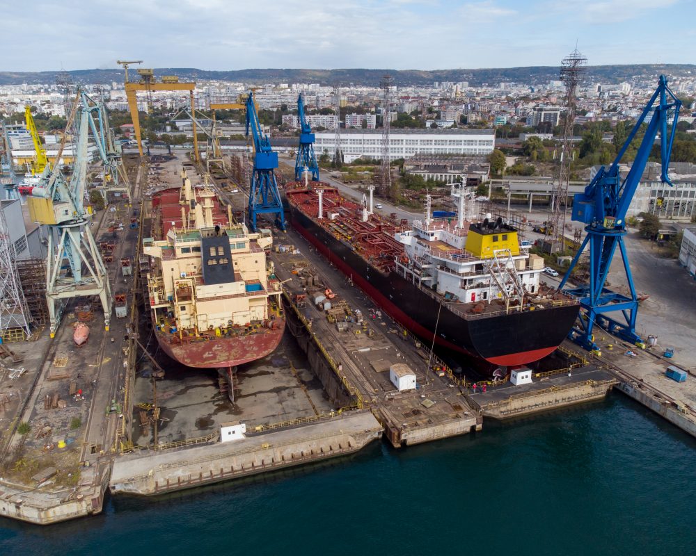 aerial view shipyard dry dock maintenance and repair cargo ship transport and oil ships in sea