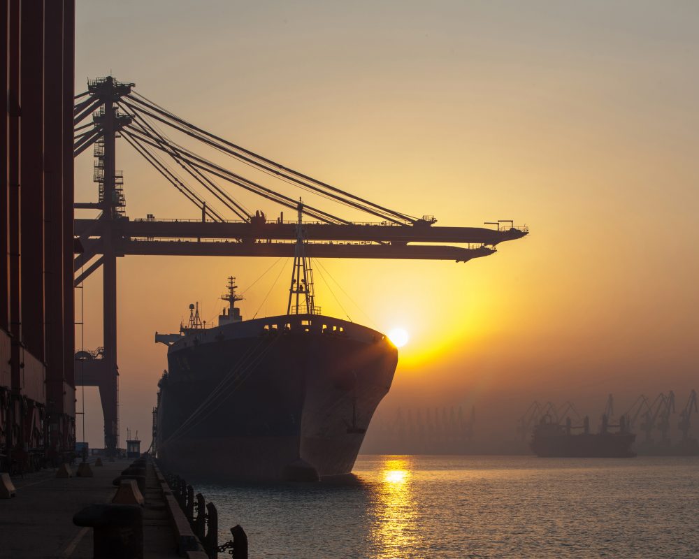 Container ship and cranes at port
